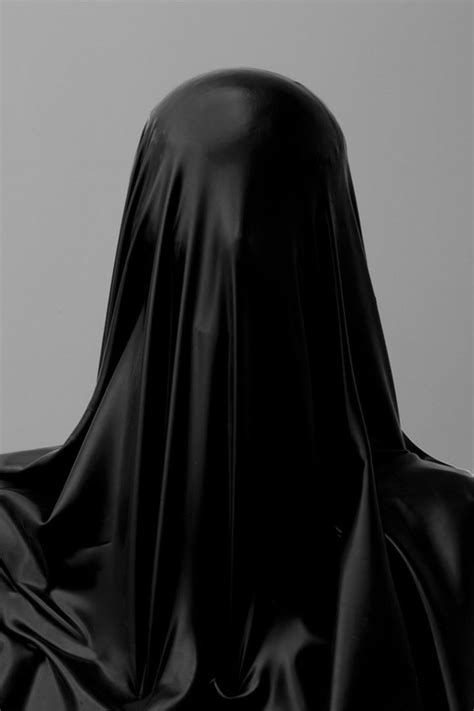A Woman Wearing A Black Hooded Cloak