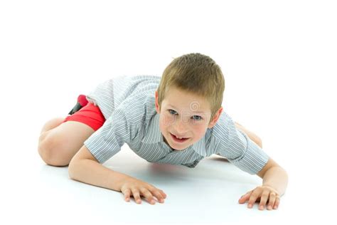 A Little Boy Is Crawling On The Floor The Concept Of Children S Stock
