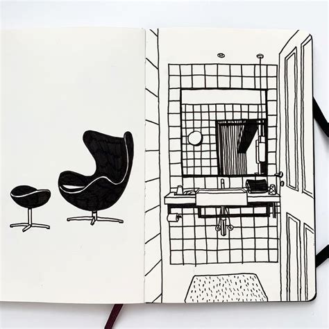 An Open Book With A Drawing Of A Chair And Desk In It On Top Of A Table