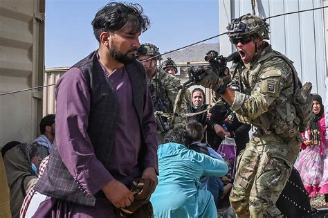 photos afghans flee taliban takeover at airport fox 2