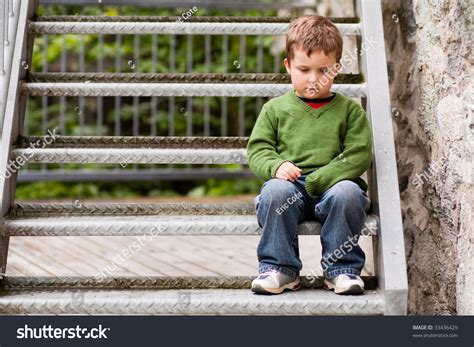 Sad Little Boy Sitting Alone On Stairs Stock Photo 33436429 Shutterstock