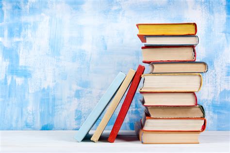 Generations of law students, lawyers, scholars, judges, and other legal professionals have relied on the bluebook's unique system of citation in their… Stack of colorful hardback books, open book on blue ...