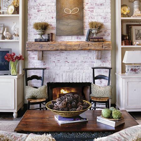 For some visual interest, the painted brick above the fireplace received a distressed finish. HOME DZINE Home Improvement | Revamp or makeover a fireplace