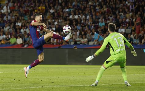 Lewandowski And Cancelo Strike As Barca Snatch 3 2 Win Over Celta Reuters