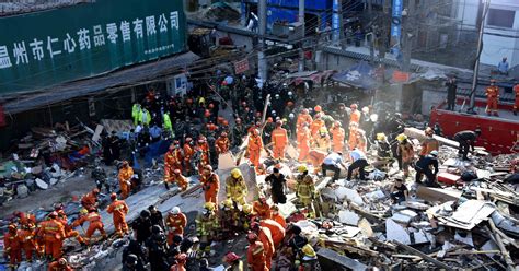 Chinese Girl Found Alive Wrapped In Dead Parents Arms After Collapse