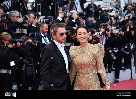 Chinese Actress Gong Li Right And Her Husband Jean Michel Jarre Pose As They Arrive On The Red
