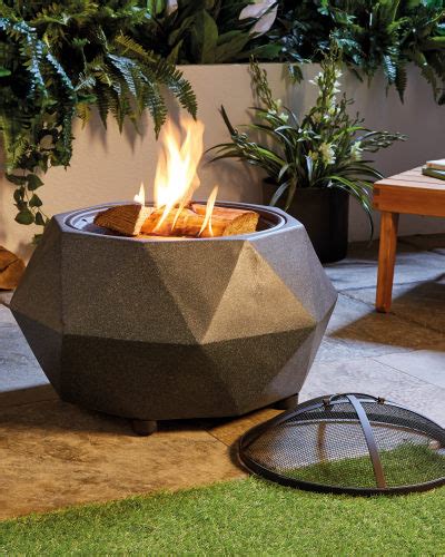 As well as a table top grill plate, there's also a moveable fire bowl, plancha cooking plate and chrome plated skewer for rotisserie cooking. Garden Fire Pit | Faux Stone Fire Pit | 2019 | ALDI UK