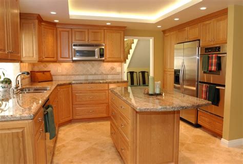 Maple and hickory, as well as trendy cherry, are the preferred domestic hardwoods for building face frames and cabinet doors. Cherry Kitchen Cabinets With Gray Wall And Quartz Countertops Ideas