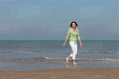 Woman On Beach Stock Photo Dissolve