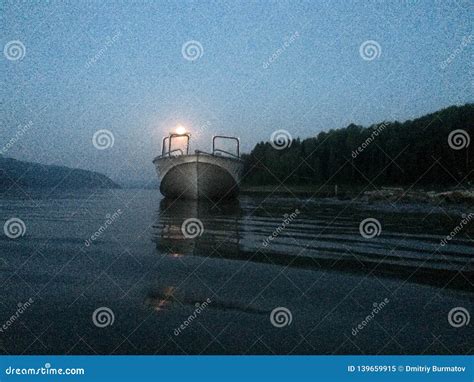 Motor Boat On The River On A Moonlit Night Captured On Iphone Stock
