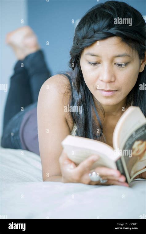 Woman Lying On Stomach Reading Hi Res Stock Photography And Images Alamy