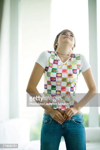 Teen Girl Trying To Button Jeans Bildbanksbilder Getty Images