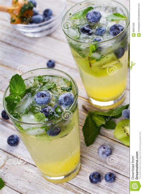Kiwi And Blueberry Mojito On Wooden Background Stock