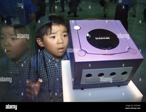 Seven Year Old Tsubasa Araki Gazes At Gamecube On Display At Nintendo
