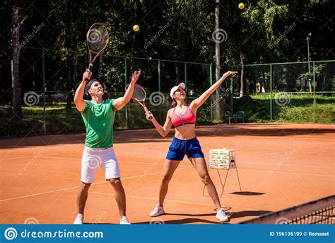 Young Athletic Woman Playing Tennis With Her Coach Stock Image Image