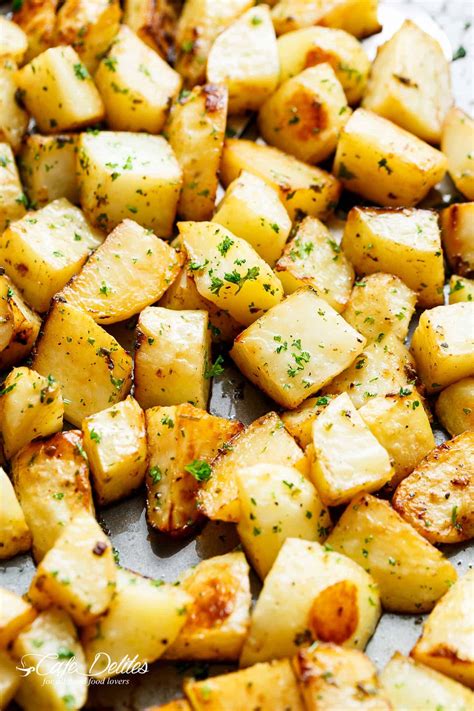 Toss to coat all the sweet potatoes and then spread out to arrange in an even layer. Crispy Garlic Roasted Potatoes - Cafe Delites - Cravings ...
