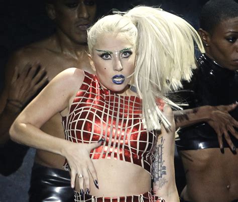 Lady Gaga Wears Assault Rifle Bra Jurassic Park 4 Ann Romney Turns Down Dwts Daily Buzz