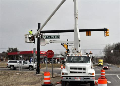 Crews Work To Finish New Traffic Signal At Walker Avenue And I 96