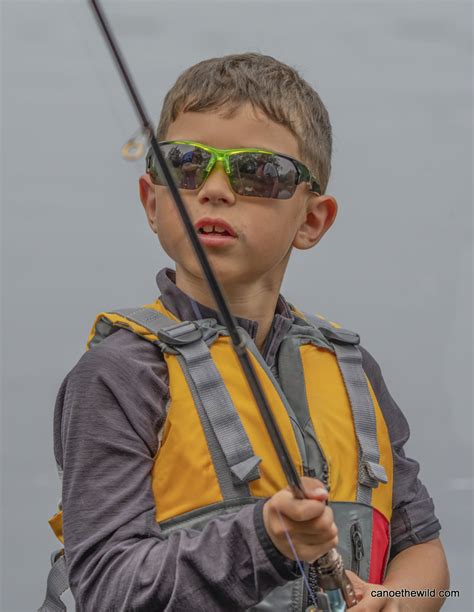 Boy With Fishing Pole Canoe The Wild