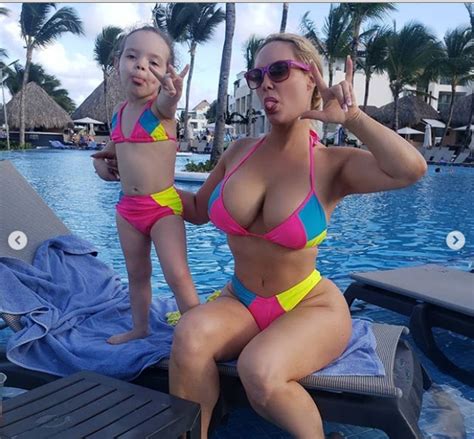 Reality Star Coco Austin Flaunts Her Assets As She Poses Poolside With Daughter In Matching