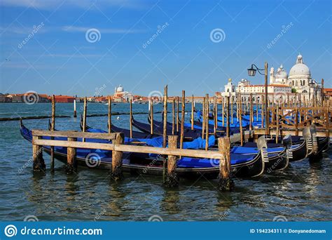Gondolas Moored Near San Marco Square In Venice Italy Stock Image