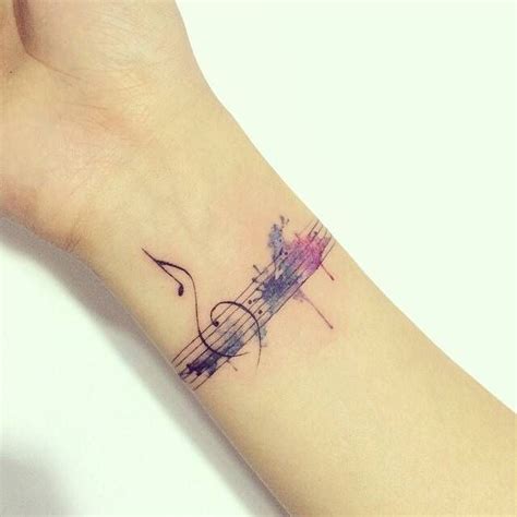 Beauty lies in the eyes of the behold and this music tattoo doesn't tell a wrong story. watercolor music tattoo | Subtle tattoos, Tattoos, Unique ...