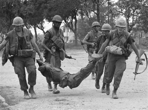 Us Marines Drag A Casualty Down A Street To An Ambulance In Hue