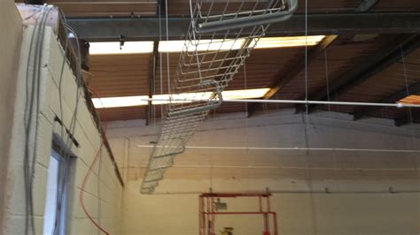 Since a smoke alarm and mounting box weigh less than 20 pounds combined, you can install them to the panel with swing tabs. Cage for cabling. Above this will be a full suspended ...