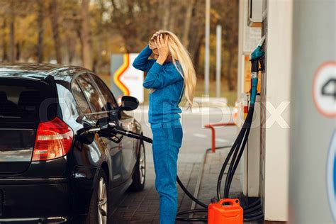 Stressed Woman On Gas Station Fuel Filling Stock Image Colourbox