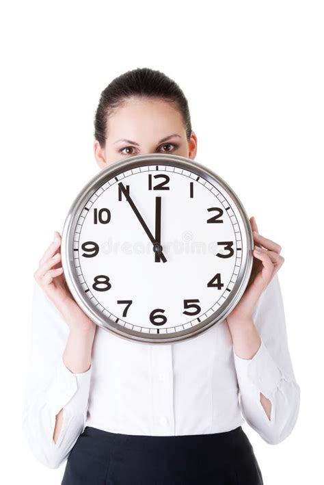 Business Woman Holding A Clock In Front Of Her Face Stock Image
