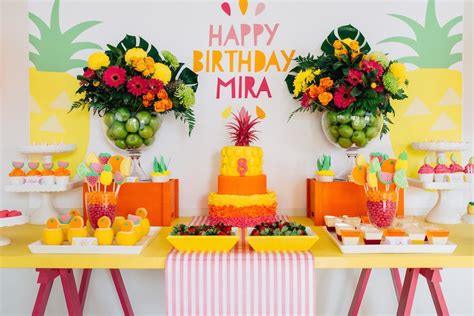 Head to the blog for fun, diy tutti fruitti birthday party ideas, including this backdrop and honeycomb fruit garland. Tutti Frutti Kids Birthday Party