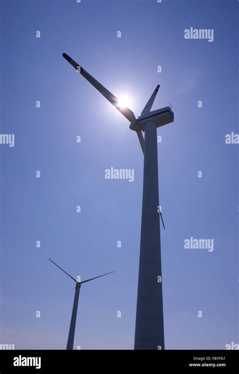 Wind Turbines Farm On A Clear Blue Sky Stock Photo Alamy
