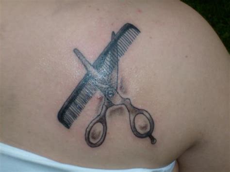 Grey Ink Scissor And Comb Tattoo On Back Shoulder