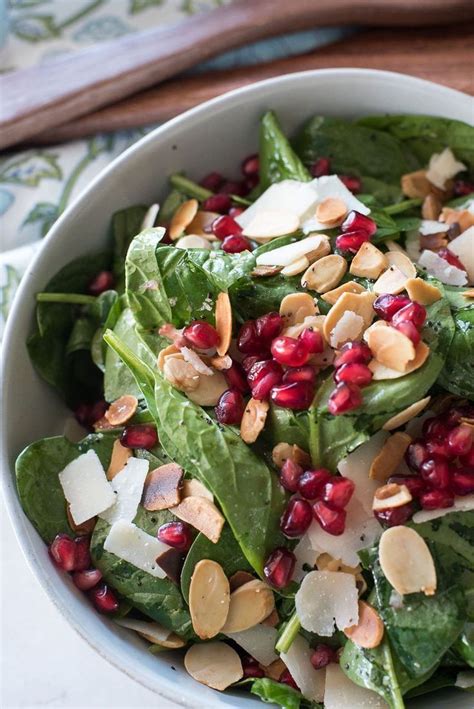 Spinach Salad With Pomegranates Toasted Almonds And Poppyseed Dressing