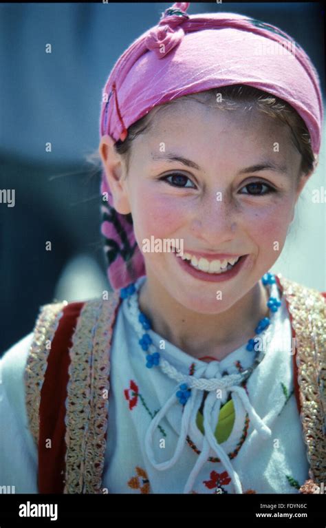 portrait of pretty smiling turkish girl from the aegean region wearing traditional dress or