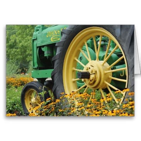 Green Tractor In A Field Of Flowers Tractor Photos Tractors Green