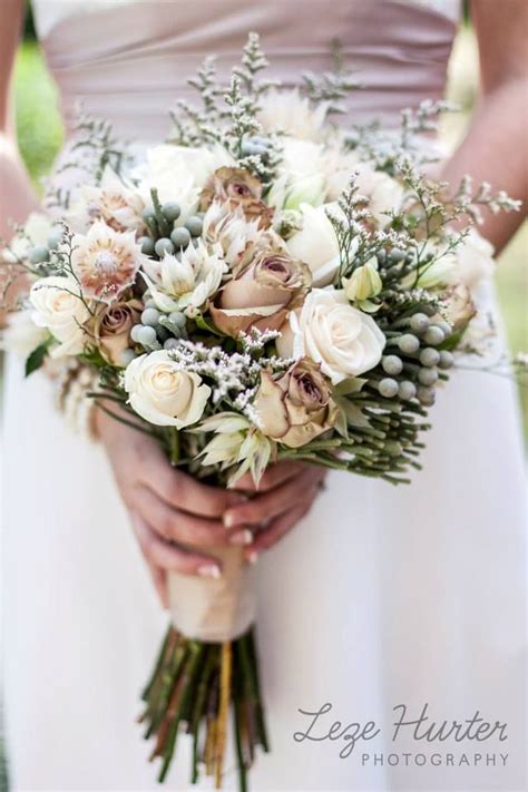 They are more refined than rustic flowers, no hessian, twine or jam jars can be found here. Vintage bouquet. The earth tone colours hold up the ...