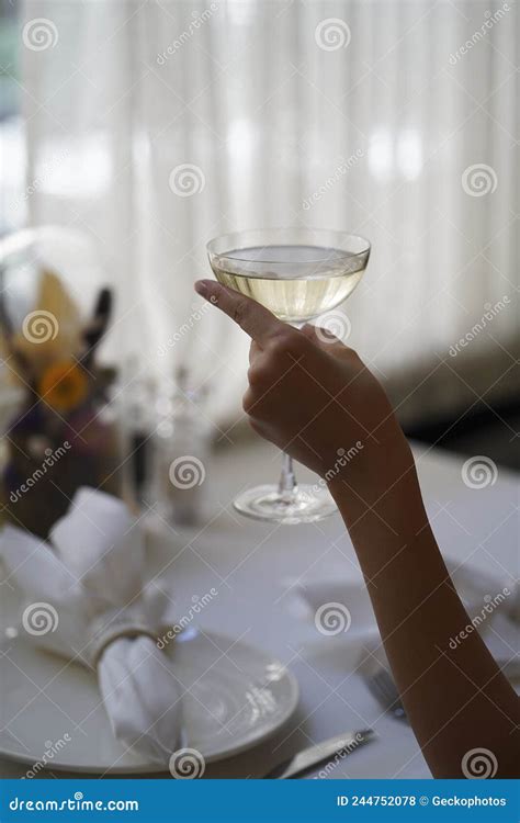 Woman Hand Holding Glass With Martini Cocktail Close Up Stock Photo