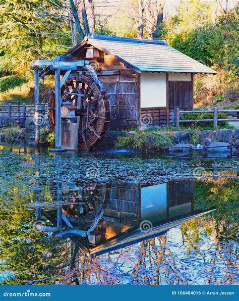 Japanese Water Wheel House Reflecting In Pond Stock Photo Image Of