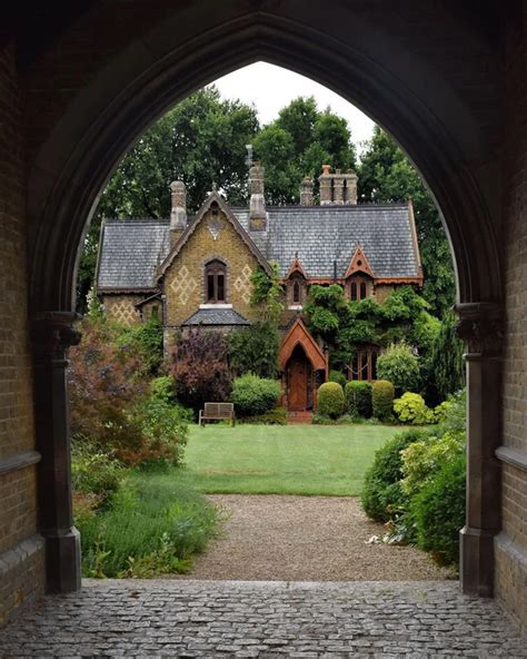 19th Century Victorian Gothic Cottage Framed By The Arch Of The
