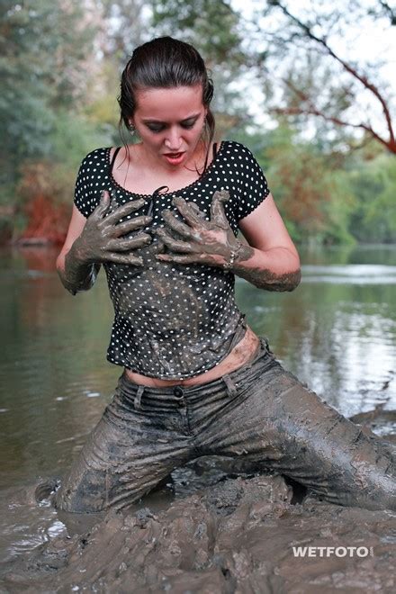 Dirty Wetlook By Two Fully Clothed Wet Girls In Mud
