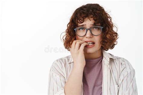 Anxious Girl Student In Glasses Woman Biting Fingernails And Looking