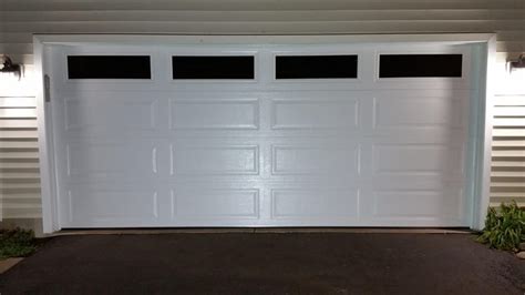 A 16x7 garage door installation lincoln 3000 long panel top section glass stockton inserts. This is a door Link 511, 16x7 , ranch panel ,white with ...
