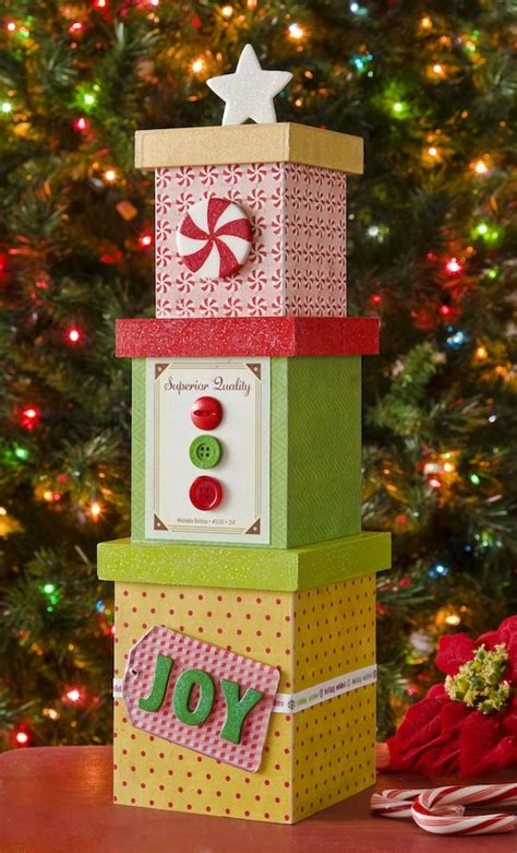 Then you blanket stitch around the edge with embroidery floss, and finally stitch the wall pieces to the bottom and then the sides together. Mini DIY Christmas tree decor from boxes - Mod Podge Rocks