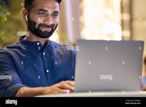 Indian Business Man Using Laptop Computer Remote Working In Night City