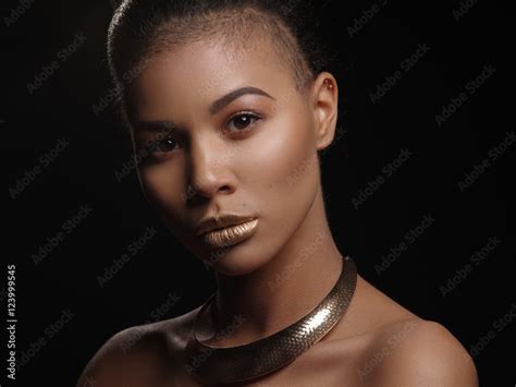 Portrait Of An Extraordinary Beautiful Naked African American Model With Perfect Smooth Glowing