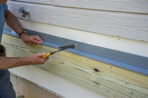 The ledger board attachment for this home was challenging because it was done after the house was constructed. Decks.com. Flashing the Ledger Board