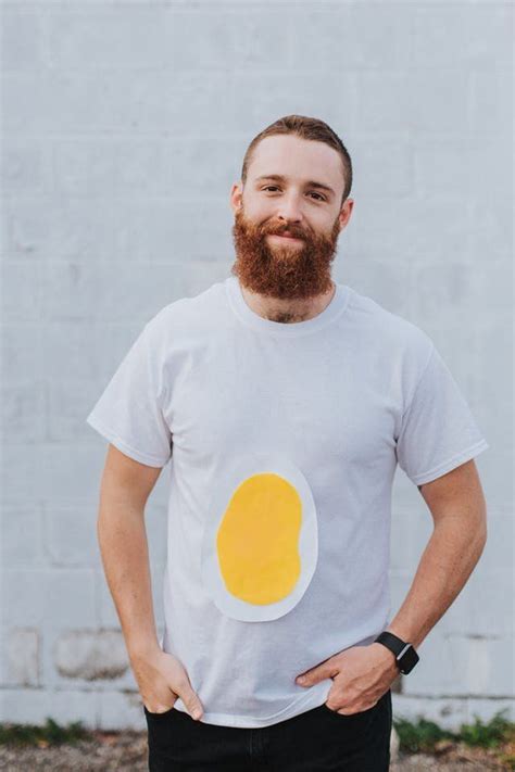 A Man With A Beard Wearing A T Shirt With An Egg On It