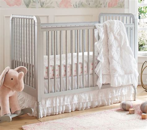 Some nursery crib sets come with a few to a dozen pieces. Organic Sadie Ruffle Baby Bedding | Pottery Barn Kids AU