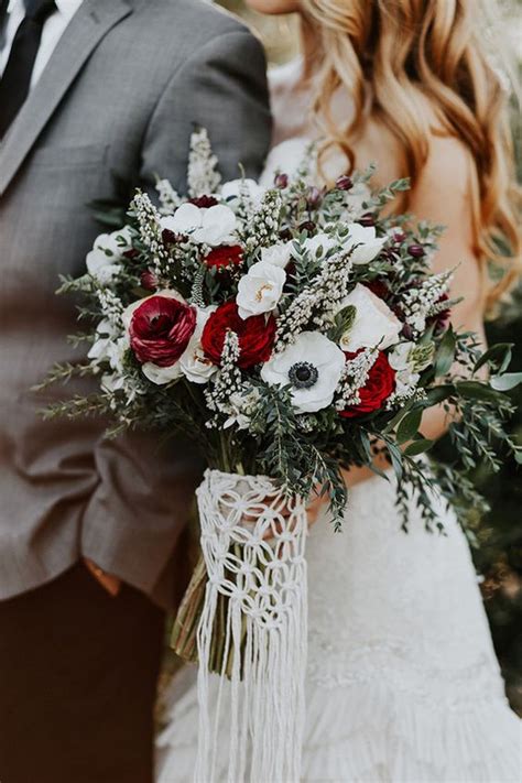 Gorgeous red bridal bouquets for the bride & bridesmaids + wedding decorations. 21 Ultra Unique Winter Wedding Bouquets | weddingsonline